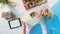 Top view of unrecognizable woman packing biscuits, processing orders desktop concept.