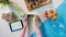 Top view of unrecognizable woman packing biscuits, processing orders desktop concept.