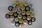 Top view of used alkaline batteries. Closeup of old AA batteries ready for recycling, colorful batteries - Image