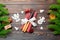 Top view of utensils on festive napkin on wooden background. Christmas decorations with dried fruits and cinnamon. Close up of New