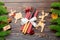 Top view of utensils on festive napkin on wooden background. Christmas decorations with dried fruits and cinnamon. Close up of New