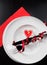 Top of view of Valentine day dinner with table setting in red and elegant heart ornaments