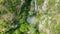 Top view with a valley and waterfall and lots of greenery