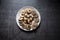 Top view of variety of cookies in a plate on a background