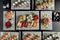 Top view of variety of Japanese dishes on dark background. Sushi with tuna, salmon, agacate, sashuimi and california roll