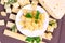 Top view of variety of parmesan and maasdam pieces cheese in the kitchen on light background.