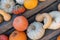 Top view of a variety of pumpkins stack on wooden board