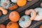 Top view of a variety of pumpkins stack on wooden board