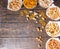 Top view of various beer snacks in plates like pistachios, small