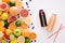 top view of various citrus fruits and blueberries with bottles of juice