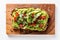 Top View, Vegan Avocado Toast On A Wooden Boardon White Background