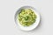 Top View Vegan Zucchini Noodles With Avocado Sauce On White Round Plate. Generative AI