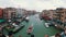 Top View of Venice Italy Grand Canal, view of the crowd of people standing on the Rialto Bridge.