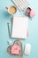 Top view vertical photo of copybooks pen keyboard computer mouse heart shaped stationery holders with clips sticky note paper and