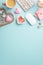 Top view vertical photo of keyboard computer mouse heart shaped stationery holders pins clips sticky note paper candles glasses