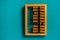 Top view of vintage abacus on a green background, the concept of mathematical calculations