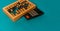 Top view of vintage abacus and modern calculator on a green background, the concept of finance and mathematical calculations