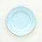 Top view of vintage white empty plate. Flat lay.