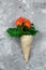 Top view waffle cone with red geranium flowers