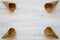 Top view, waffle sweet cones over white wooden background.