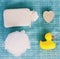 Top view of washing sponge, soap and ruber duck