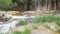 Top view of a waterfall with the water stream running by sedimentary rocks