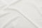 Top view of wavy white cotton tablecloth