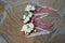 Top view of wedding boutonnieres for the groom and bridesmaids on stone background. Wedding details outdoor.