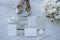 top view of wedding invitations with bridal shoes and bouquet