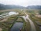 Top view of the wetlands of the island of Cat BA near the sea on land. Morning gloomy landscape of  countryside of Vietnam