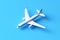 Top view of a whimsical cartoon airplane flying against a blue background, perfect for children's books or toy