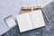 Top view of white binder blank notebook or diary or journal for writing text and message with pencil on concrete background with