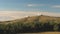 Top view of white domed buildings of observatories on hill. Shot. Astronomical research facilities and large