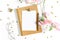 Top view of white working table background with office equipment putting on it. Flat lay glass, flower, golden paper binder clips