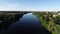 Top view of a wide river with blue water.