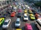 Top view of a wide street with multi-lane traffic, heavy traffic from colorful cars