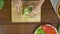 Top view of woman chief making salad healthy food and chopping lettuce on cutting board in the kitchen