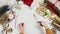 Top view of woman cutting ribbon for wrapping christmas presents