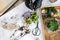 Top view woman gardener hands in protective gloves arrangement succulents into glass florariums