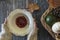 Top view of woman hands holding a vintage bowl with drunken pears dessert. Autumn composition