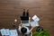 Top view woman working on laptop with talking smart phone on wooden floor