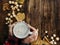 Top view Womans hands in red shirt with Cappuccino with popcorn