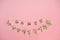 Top view women spelled in wooden blocks on pink background. Love, 8 march background. Gift, greeting, compliment concept. Copy