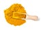 Top view of wood scoop on Turmeric powder on white