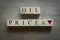 Top view of wooden block written with alphabet of Oil price with green and red arrow represent the oil price crisis during the