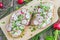 Top View Wooden Board with Two Slices of Bread with Curd Cheese, Radishes and Chive on Wooden Table