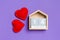 Top view of wooden calendar and textile hearts on colorful background. The fourteenth of February. Valentine`s day concept