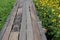 Top view wooden floor walkway beautiful flower garden outdoor path image concept for nature travel background.