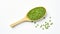 Top view of wooden spoon with green lentils on a white background. Healthy vegetarian food, rich in protein and vitamins