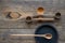 Top view wooden spoons and plates made of precious wood on wooden table, eco-friendly cutlery concept, selective focus